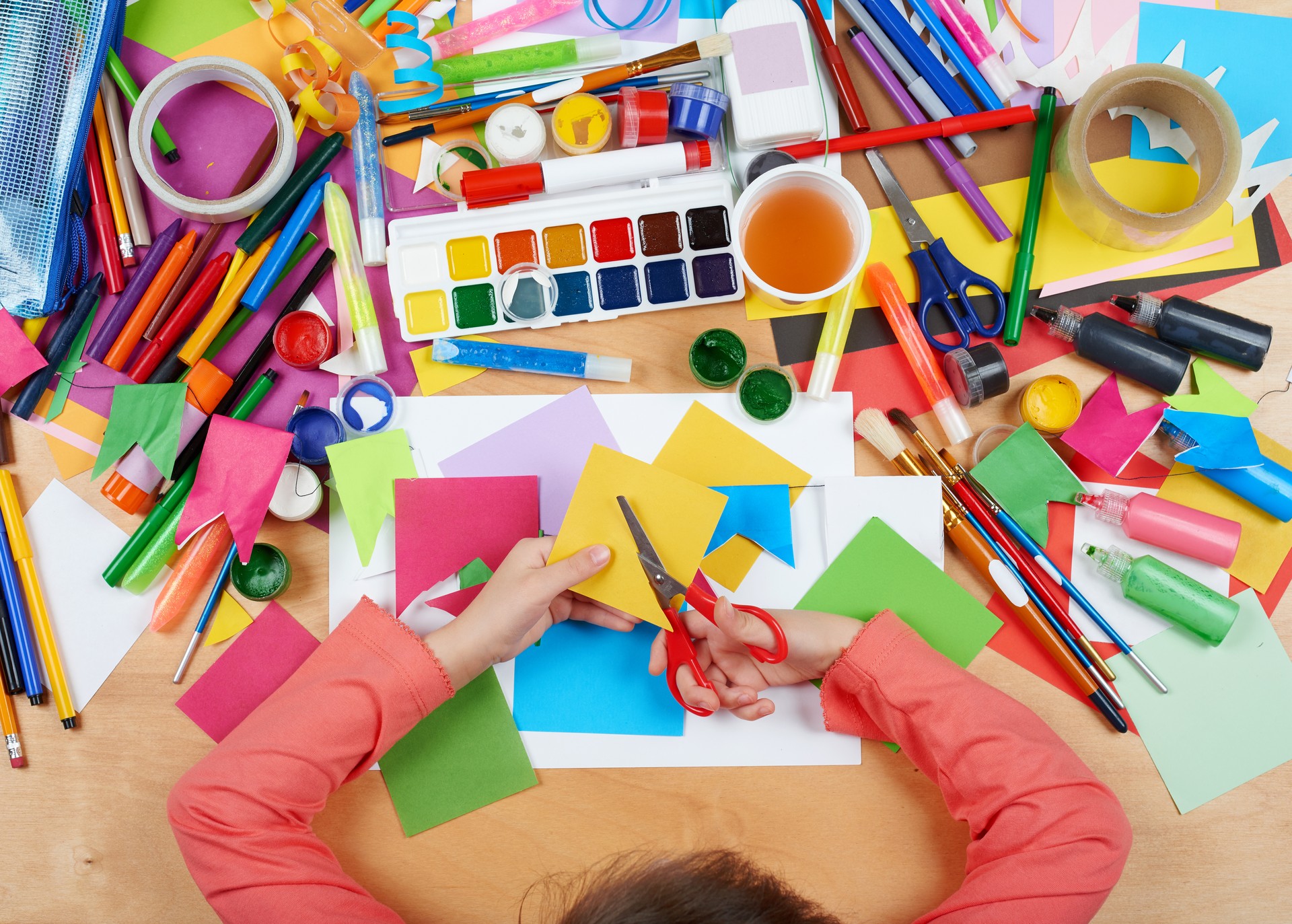 Child drawing top view. Artwork workplace with creative accessories. Child drawing top view. Artwork workplace with creative accessories.